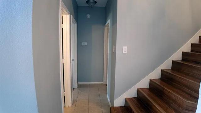 a view of an entryway with wooden floor
