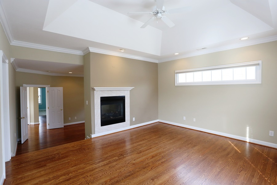 3109 Bentley Hill Road Raleigh, NC 27612 - Photo 14 of 25 The master bedroom has a dual sided fireplace and gorgeous hardwood floors. The Sellers added custom black out cell shades so you can sleep in on those more laid back days. Master Bedroom