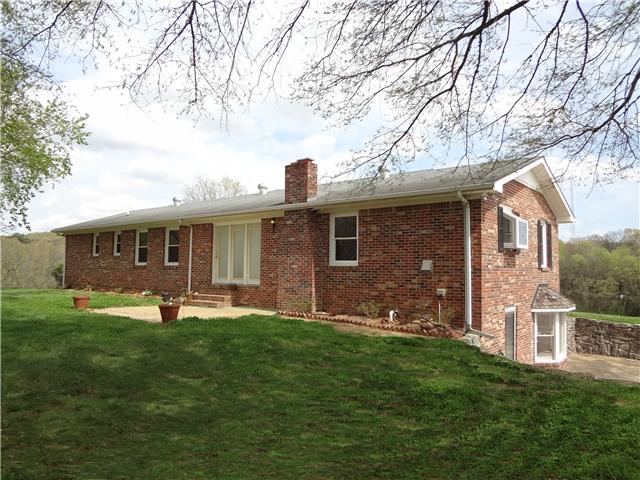 360 Beasley Branch Road Prospect, TN 38477 - Photo 3 of 20 a front view of house with a garden and trees