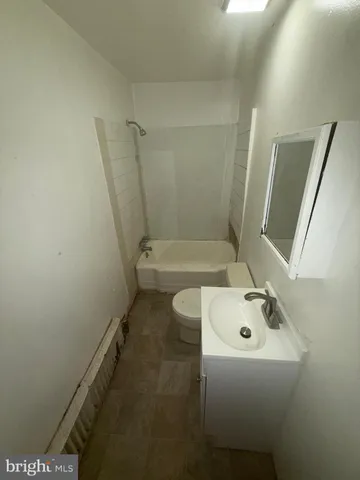 a bathroom with a sink and mirror
