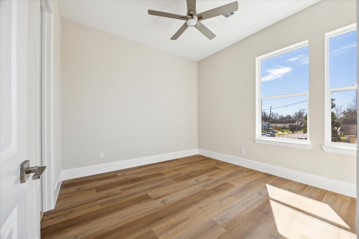 5613 Leonard Street Houston, TX 77023 - Photo 15 of 21 a view of a room with wooden floor and window