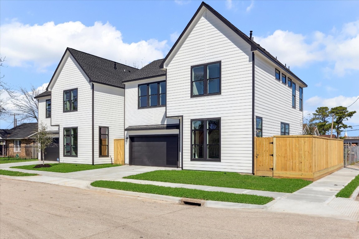 5613 Leonard Street Houston, TX 77023 - Photo 20 of 21 a view of a white house with a yard and a large space