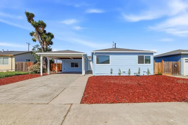 front view of a house with a yard