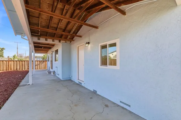 a view of hallway with wooden floor