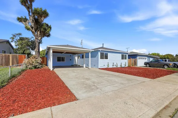 a house view with a garden space