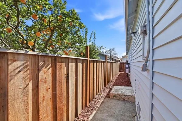 a front view of a house with a yard and a garage