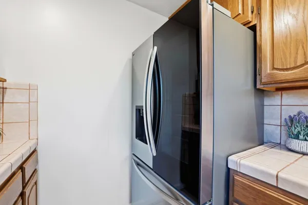 a close view of a refrigerator and stove
