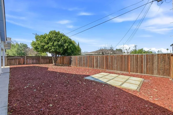 a backyard of a house with lots of green space