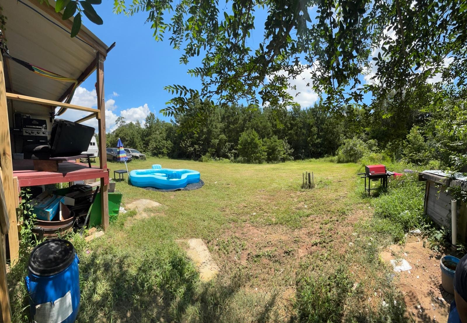 5605 Frst Vista Court Conroe, TX 77306 - Photo 11 of 34 a backyard of a house with table and chairs