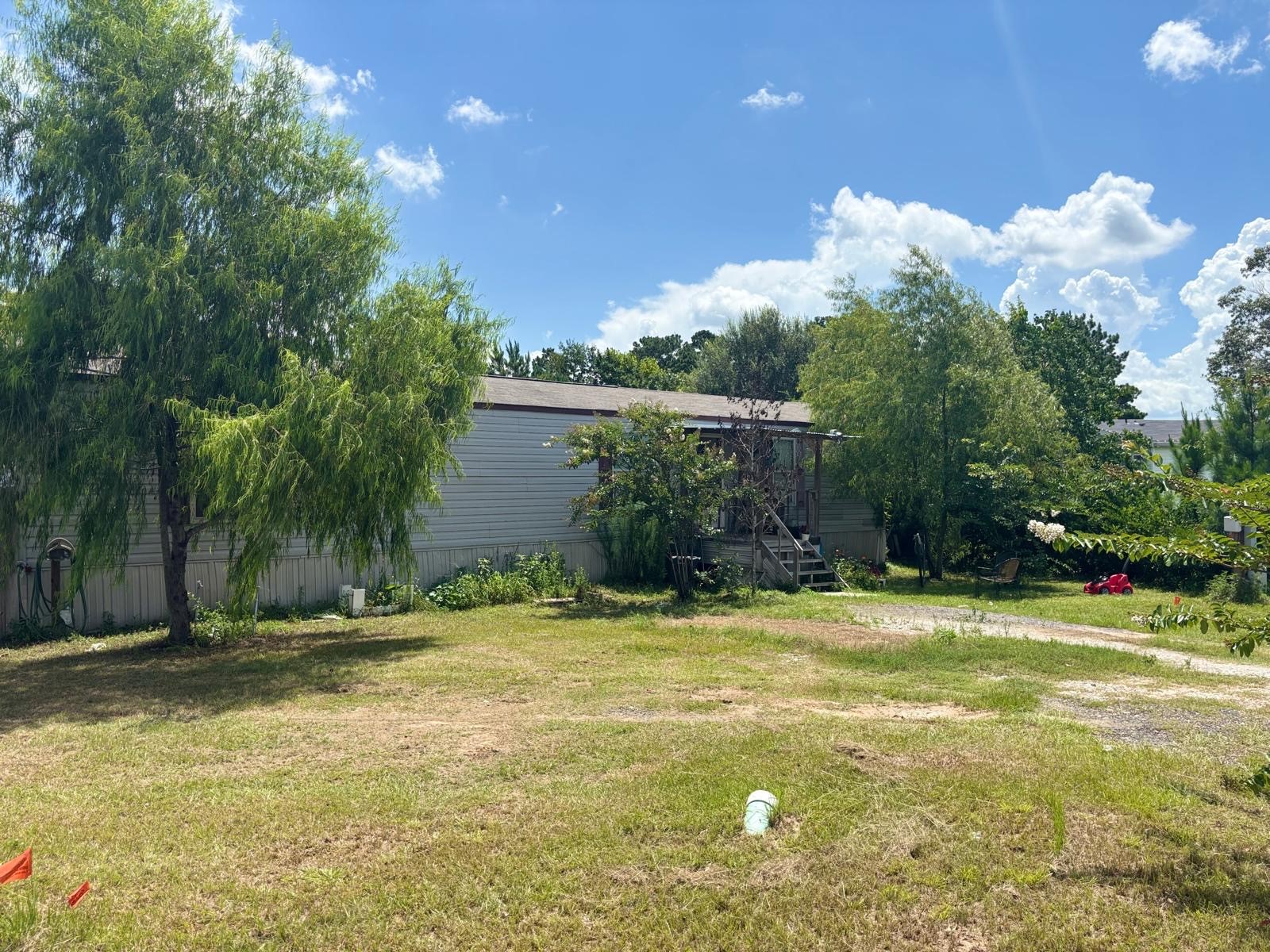 5605 Frst Vista Court Conroe, TX 77306 - Photo 2 of 34 a view of a swimming pool with an outdoor space and seating area