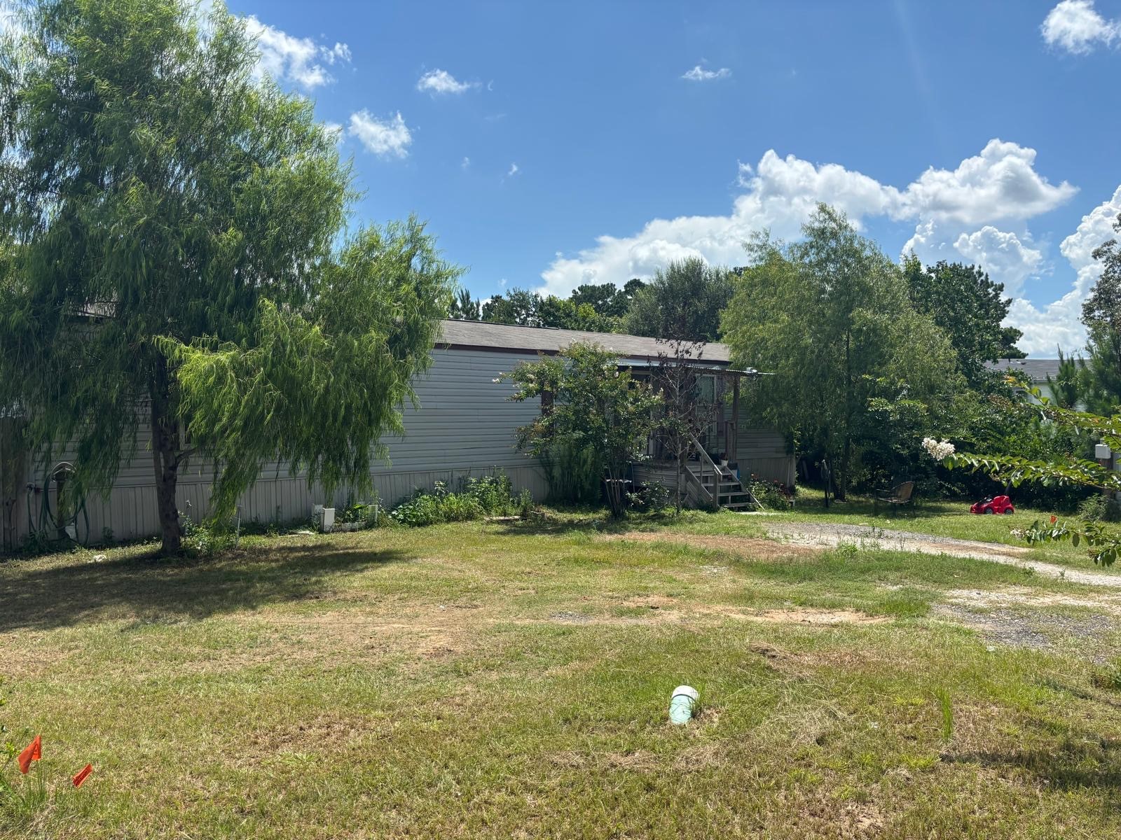 5605 Frst Vista Court Conroe, TX 77306 - Photo 34 of 34 a view of a swimming pool with a yard and palm trees