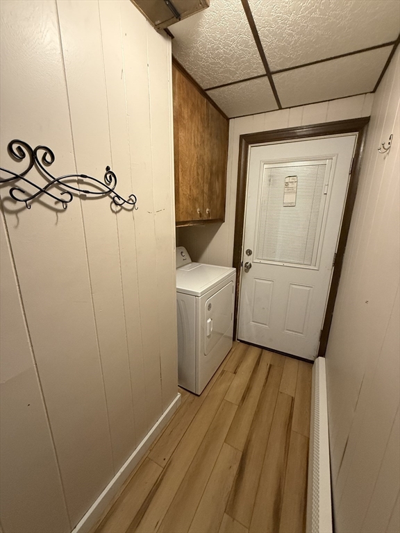 92 Stanton Street, Unit 3 Worcester, MA 01605 - Photo 12 of 18 a view of a storage & utility room with a washer dryer