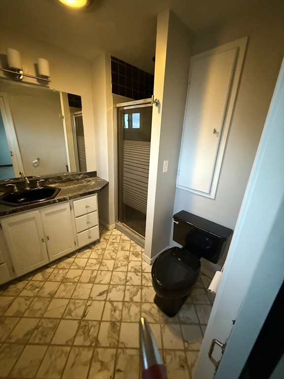 92 Stanton Street, Unit 3 Worcester, MA 01605 - Photo 17 of 18 a bathroom with a sink and a mirror