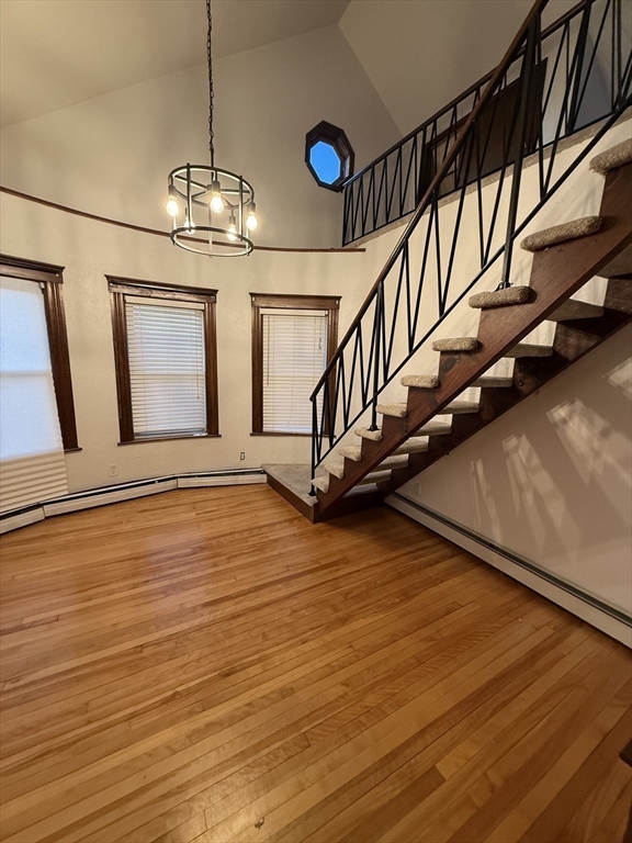 92 Stanton Street, Unit 3 Worcester, MA 01605 - Photo 5 of 18 a view of an empty room with wooden floor