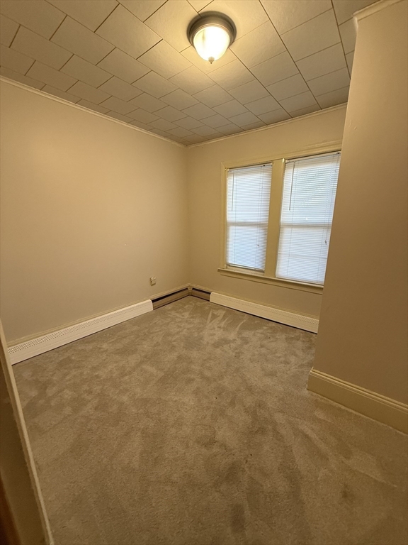 92 Stanton Street, Unit 3 Worcester, MA 01605 - Photo 6 of 18 an empty room with a window