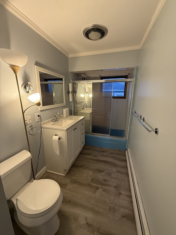 92 Stanton Street, Unit 3 Worcester, MA 01605 - Photo 9 of 18 a bathroom with a sink a toilet and mirror