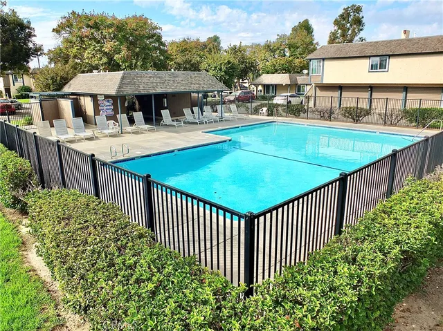 a view of a balcony with two chairs and a table