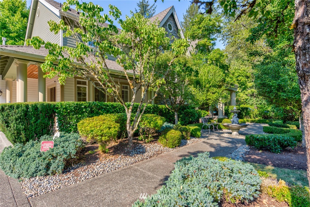 18416 Southeast 195th Place Renton, WA 98058 - Photo 2 of 32 a house is sitting in middle of garden