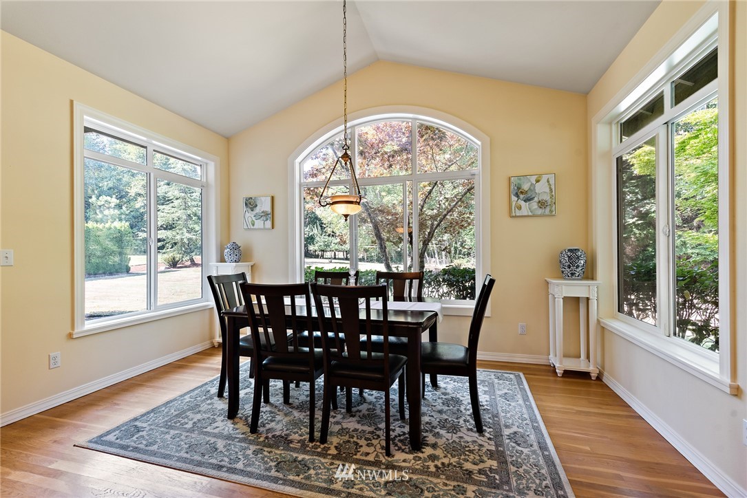 18416 Southeast 195th Place Renton, WA 98058 - Photo 11 of 32 a view of a dining room with furniture window and wooden floor