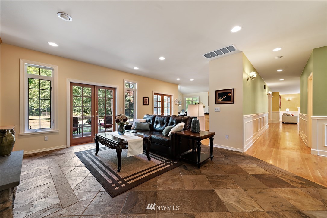 18416 Southeast 195th Place Renton, WA 98058 - Photo 14 of 32 a living room with furniture and a wooden floor