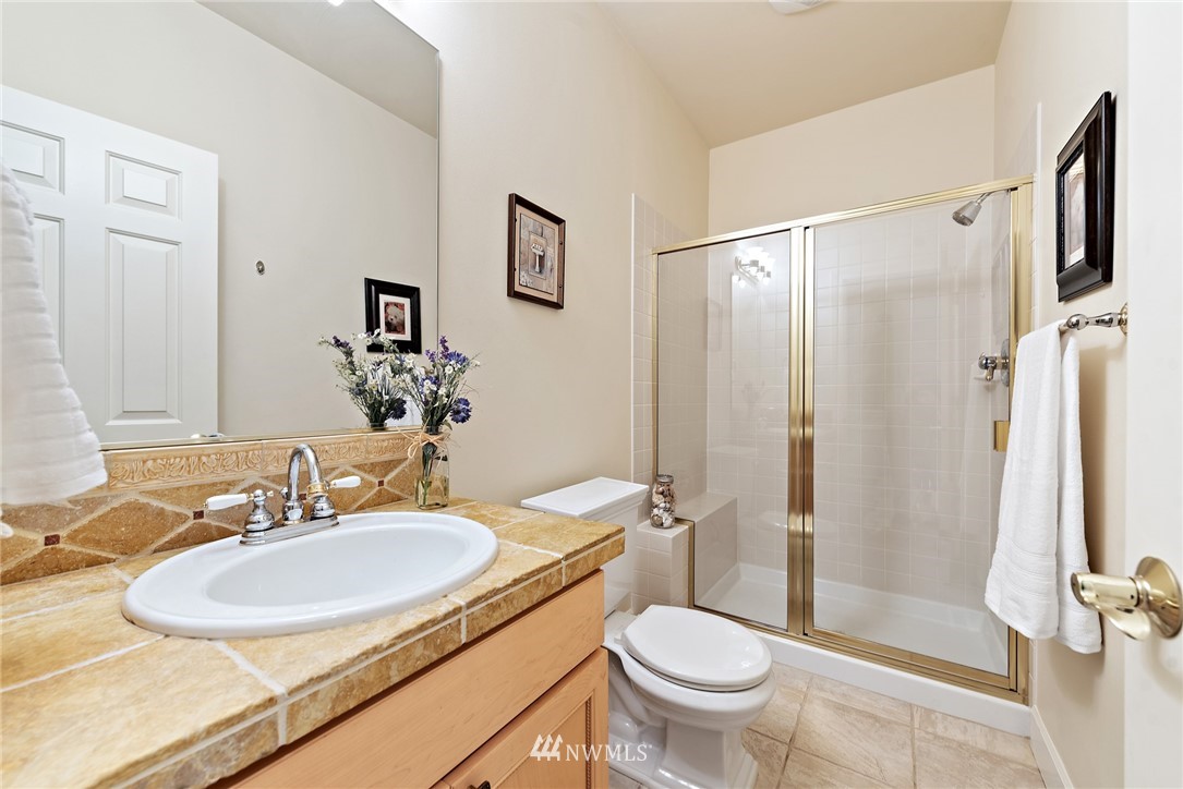18416 Southeast 195th Place Renton, WA 98058 - Photo 17 of 32 a bathroom with a sink toilet and shower