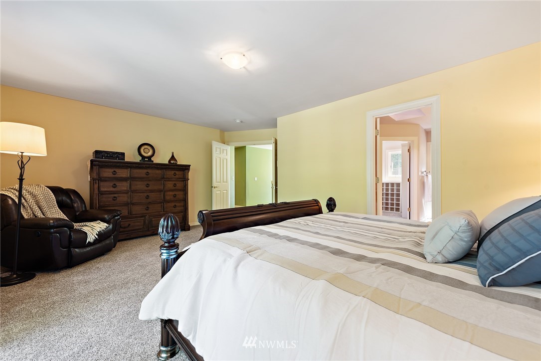 18416 Southeast 195th Place Renton, WA 98058 - Photo 19 of 32 a bedroom with a bed and a couch