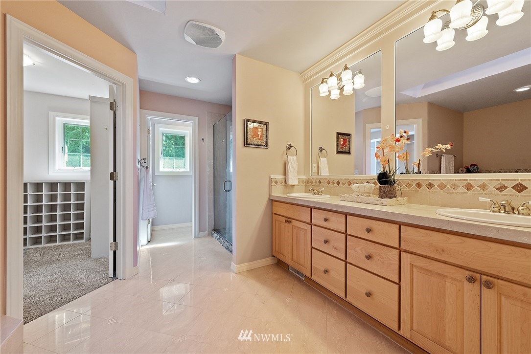 18416 Southeast 195th Place Renton, WA 98058 - Photo 21 of 32 a spacious bathroom with double sink and a mirror