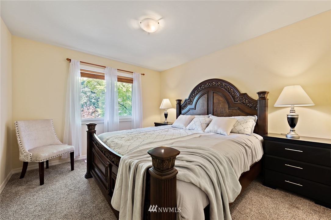 18416 Southeast 195th Place Renton, WA 98058 - Photo 23 of 32 a bedroom with a bed and window