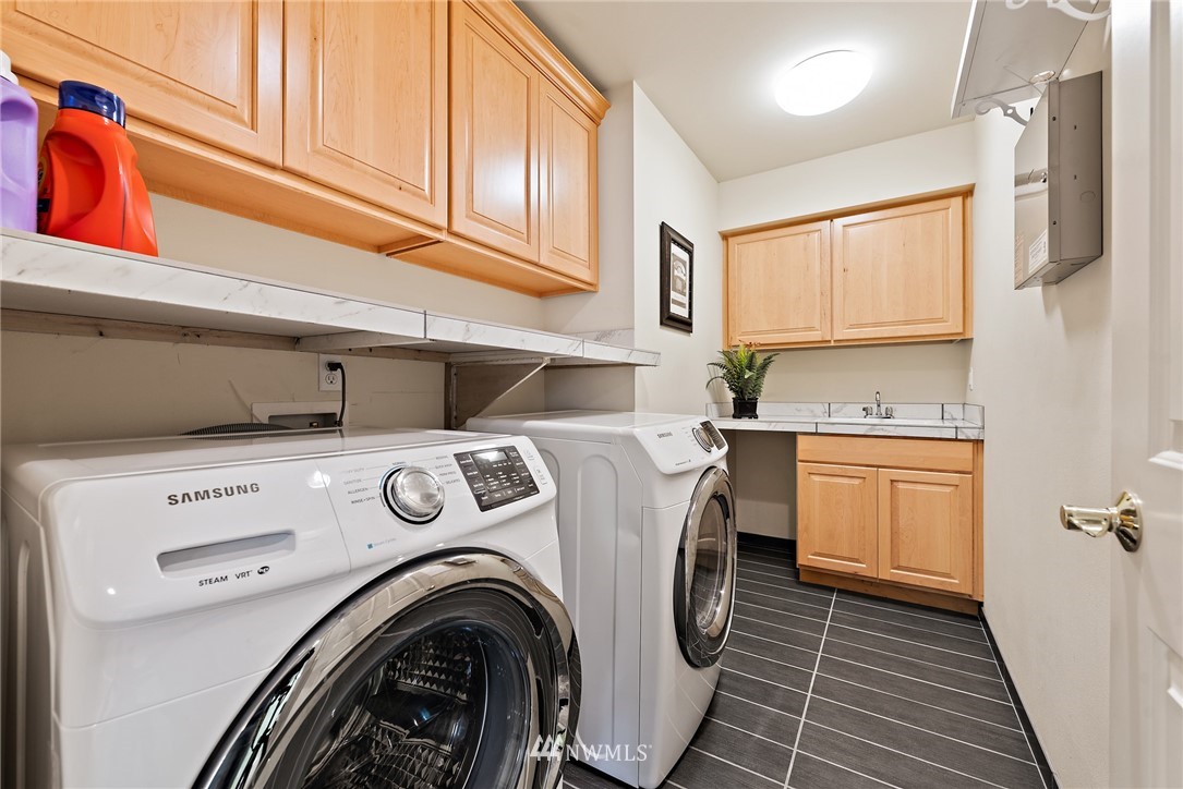 18416 Southeast 195th Place Renton, WA 98058 - Photo 27 of 32 a utility room with closet dryer and washer