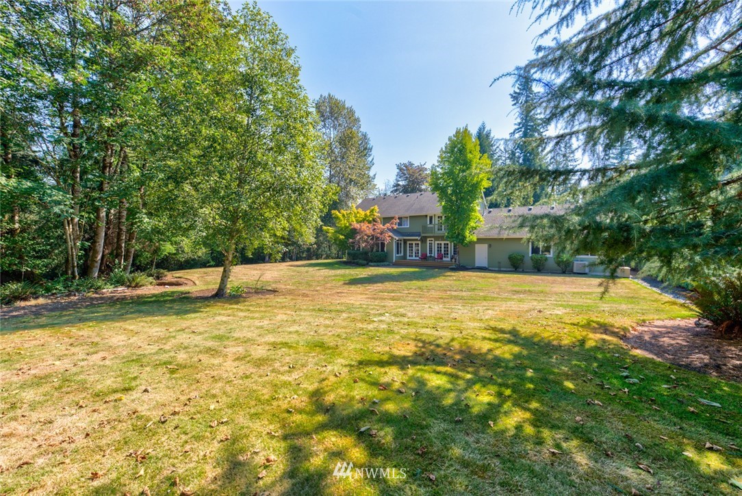 18416 Southeast 195th Place Renton, WA 98058 - Photo 31 of 32 a swimming pool with trees in the background