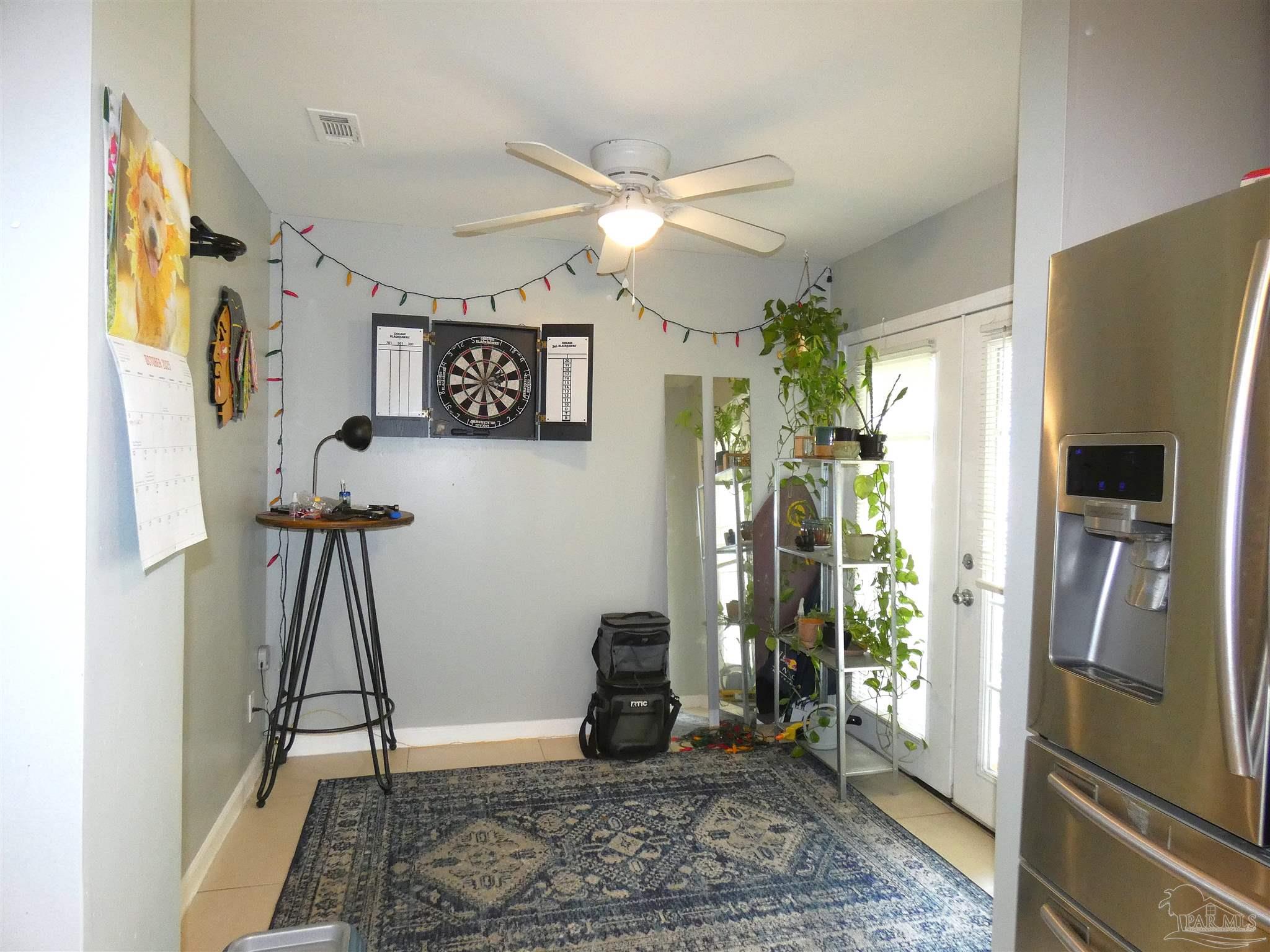 7704 West Gadsden Street Pensacola, FL 32506 - Photo 4 of 18 a view of a hallway with furniture and a window