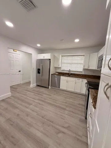 a view of a kitchen with a sink