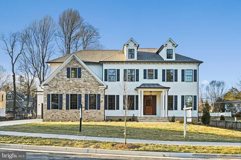 a front view of a residential apartment building with a yard