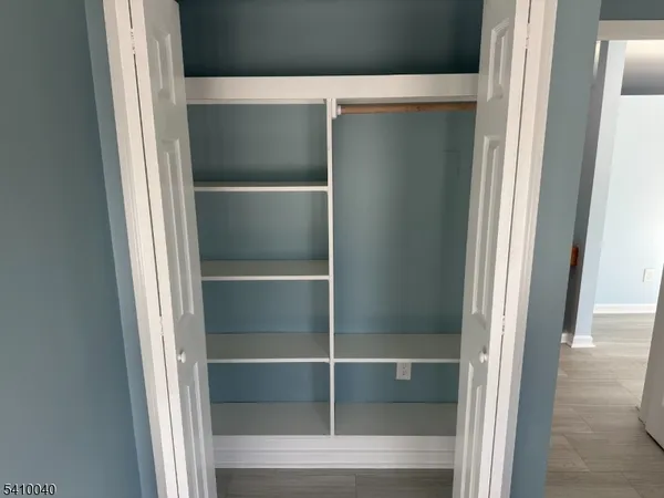 a bathroom with a glass shower door