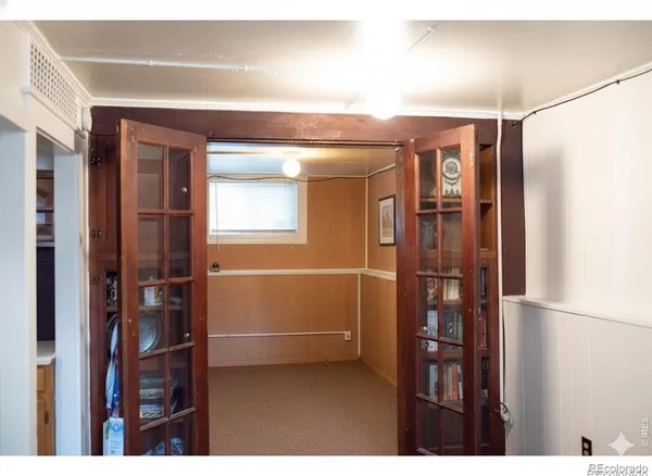 a view of a storage & utility room with closet dryer