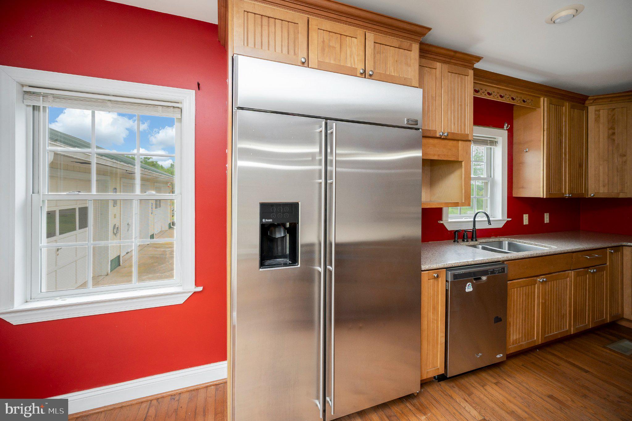23202 Village Road Unionville, VA 22567 - Photo 27 of 58 a kitchen with stainless steel appliances granite countertop a refrigerator and a sink