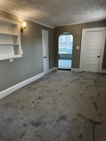 a view of empty room with front door