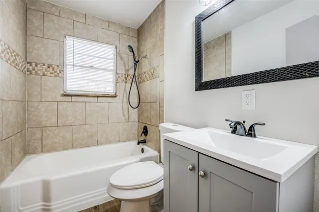 a bathroom with a sink a toilet and a bathtub