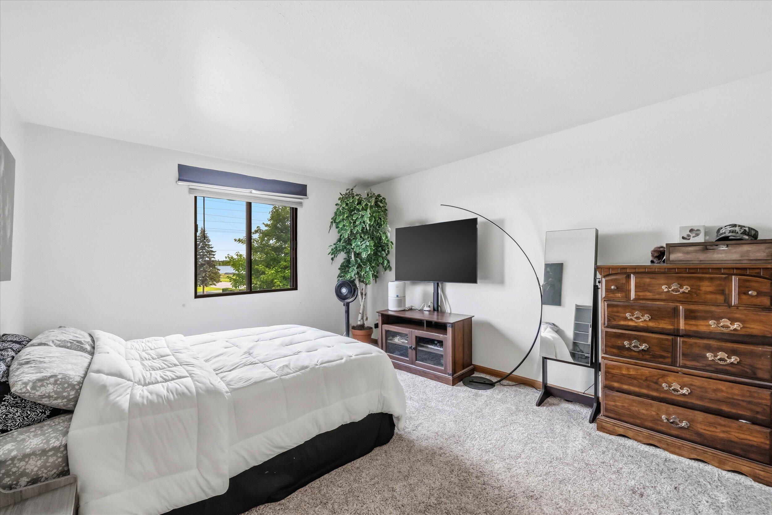 1406 Creek Road, Unit 7 West Bend, WI 53090 - Photo 12 of 25 12-Primary Bedroom