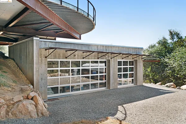 a front view of a house with a large window