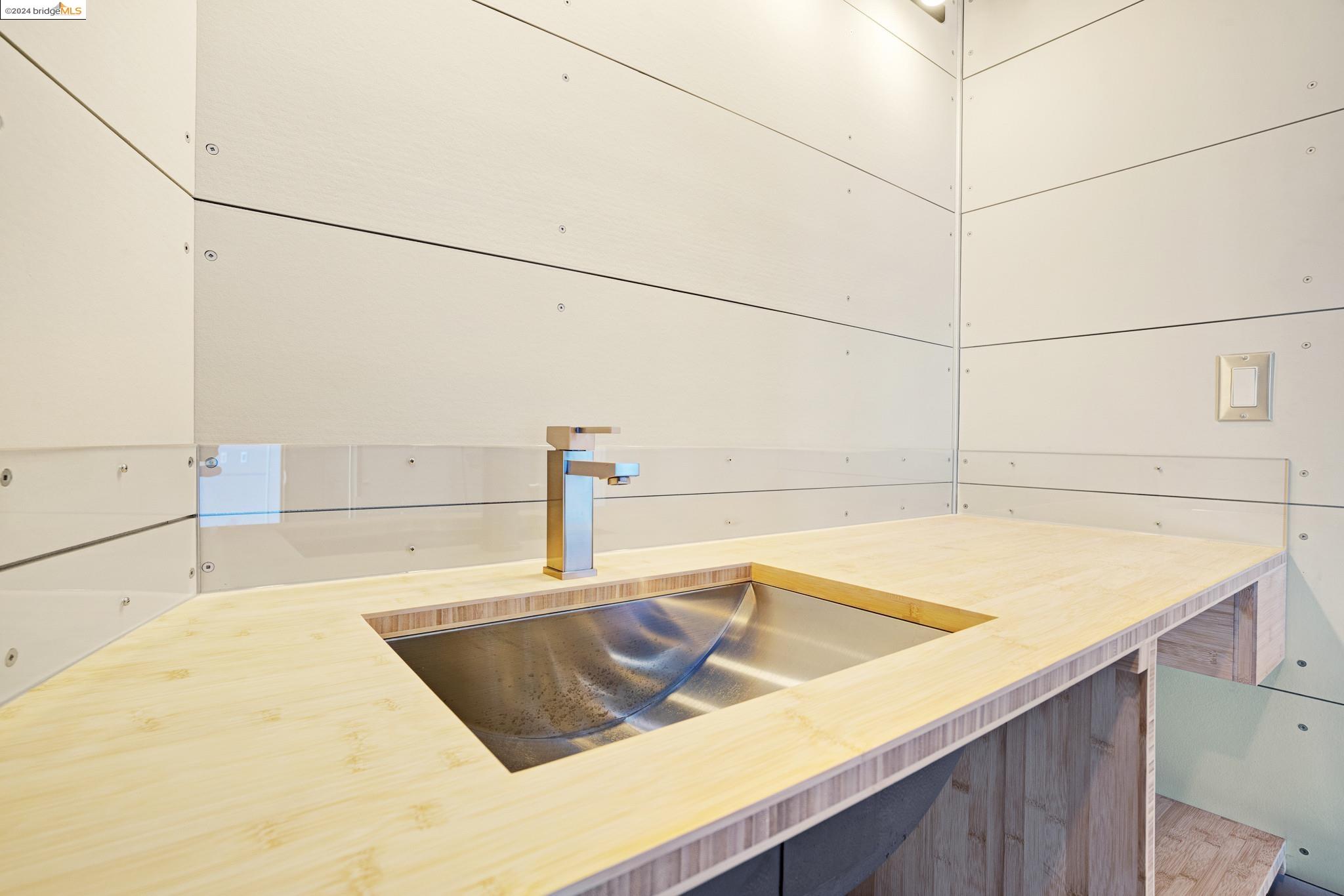 3599 Hector Road Newcastle, CA 95658 - Photo 21 of 51 a kitchen with a sink a stove and white cabinets