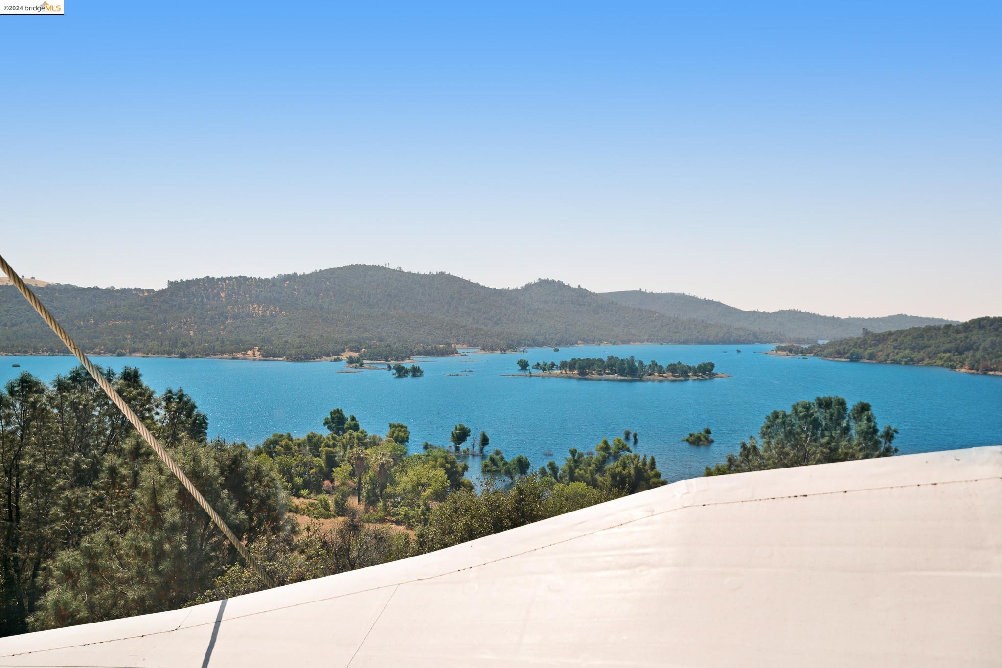 3599 Hector Road Newcastle, CA 95658 - Photo 37 of 51 a view of a lake with a mountain in the background