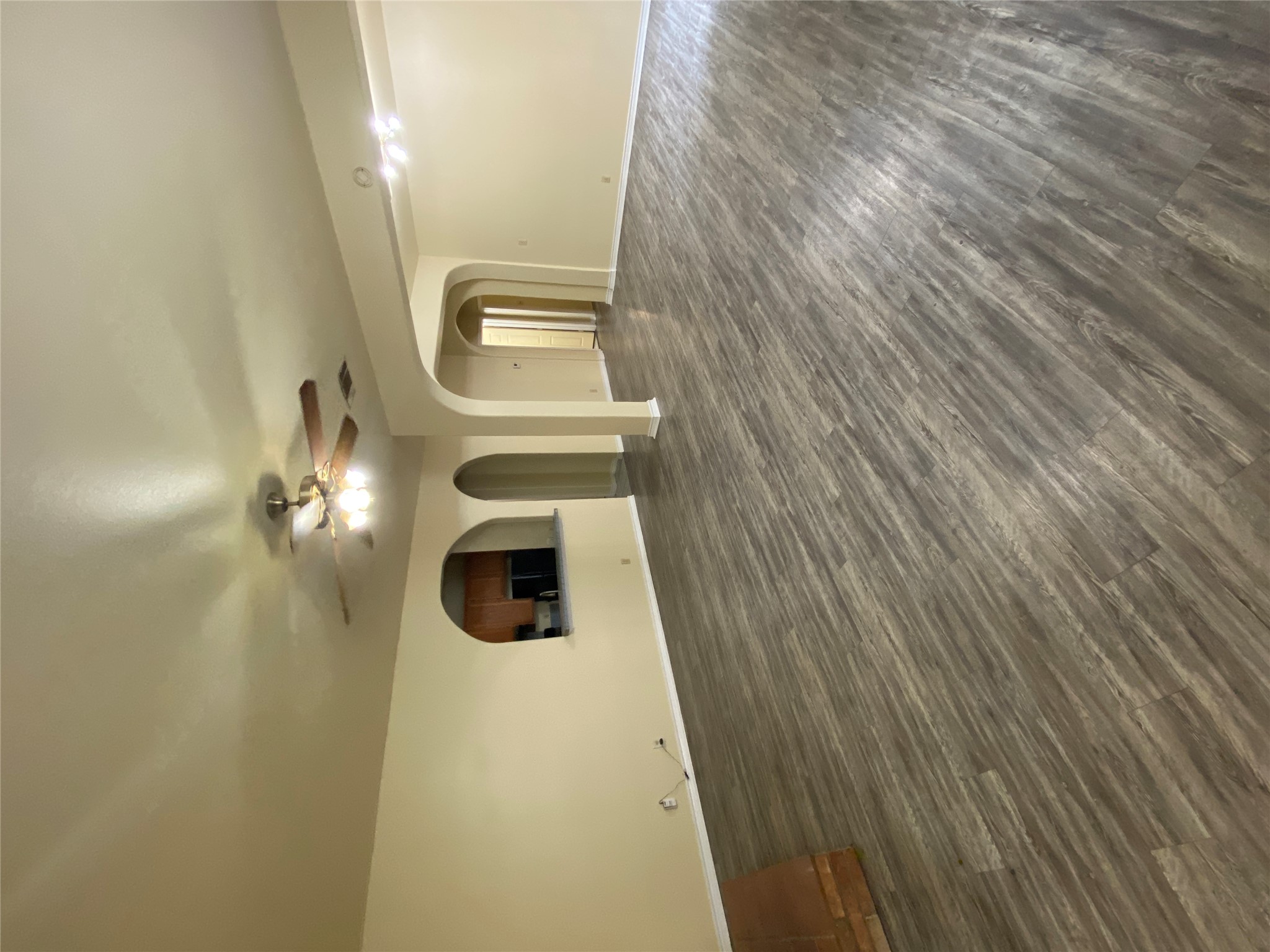 2605 Alcott Lane, Unit B Austin, TX 78748 - Photo 2 of 15 An inviting open-concept living space features wood flooring and a kitchen pass-through.