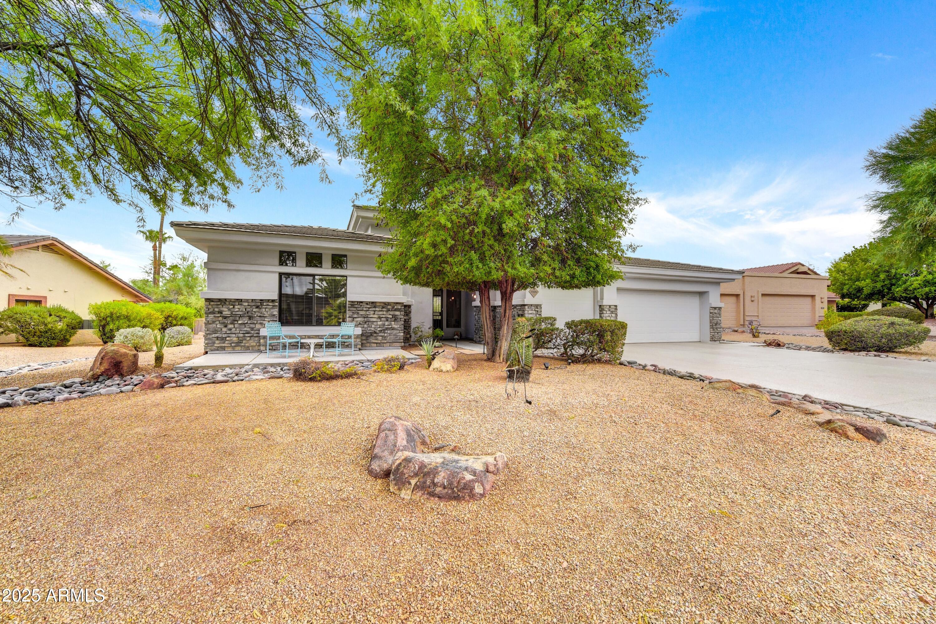19057 East Alondra Way Rio Verde, AZ 85263 - Photo 1 of 21 a swimming pool view with a seating space