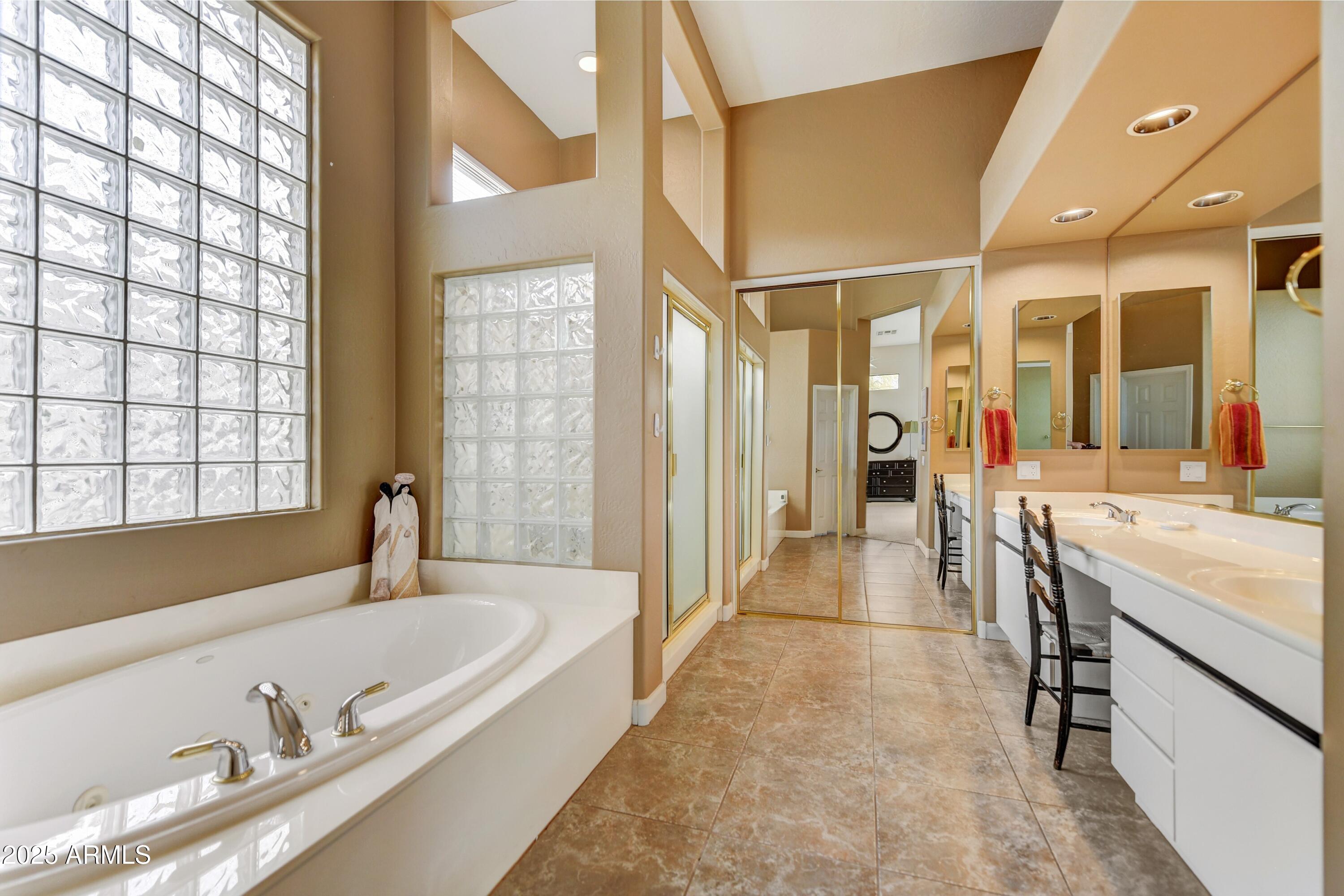 19057 East Alondra Way Rio Verde, AZ 85263 - Photo 12 of 21 a large spacious bathroom with a large tub and sink