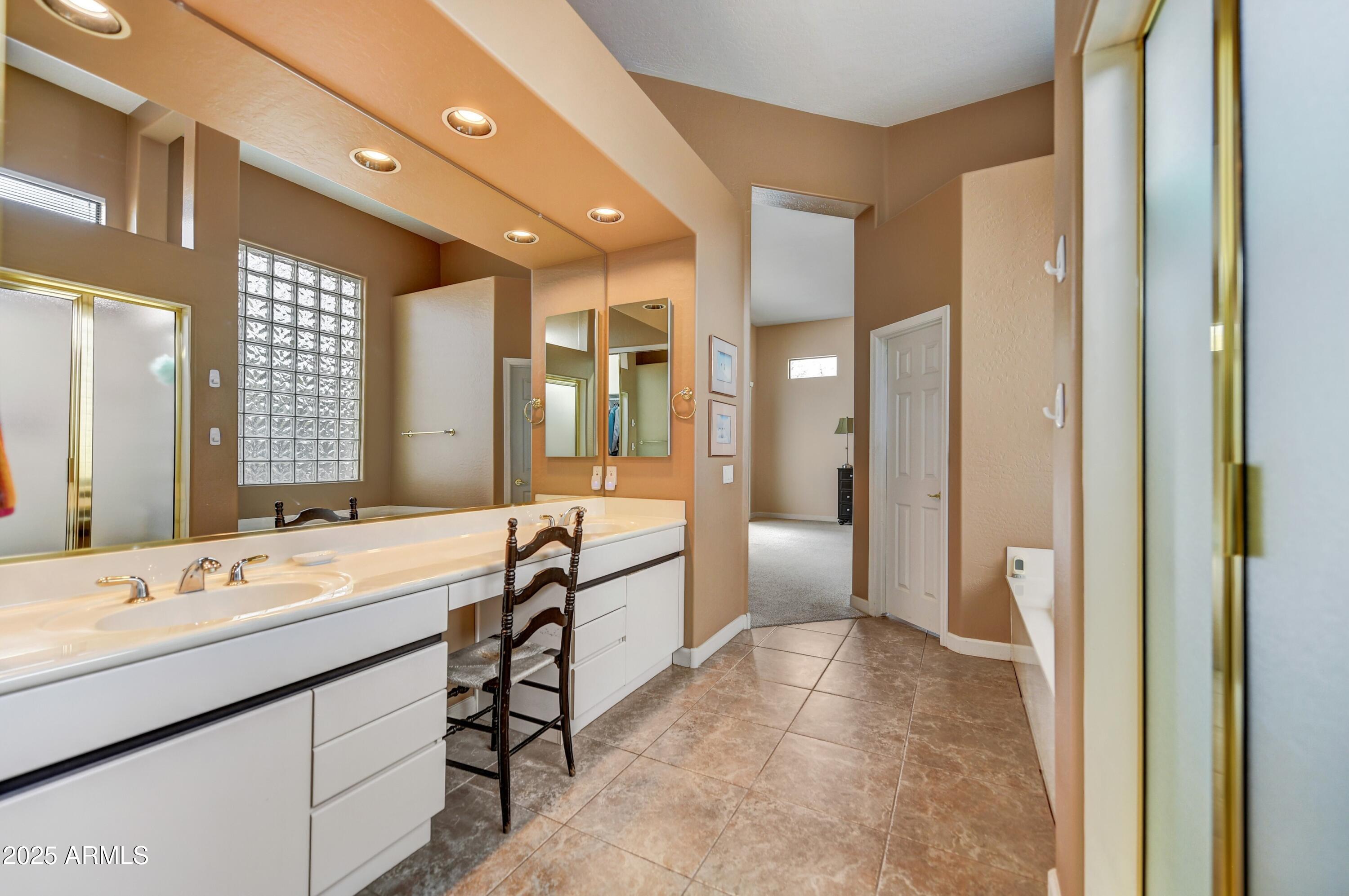 19057 East Alondra Way Rio Verde, AZ 85263 - Photo 13 of 21 a spacious bathroom with a double vanity sink mirror and shower