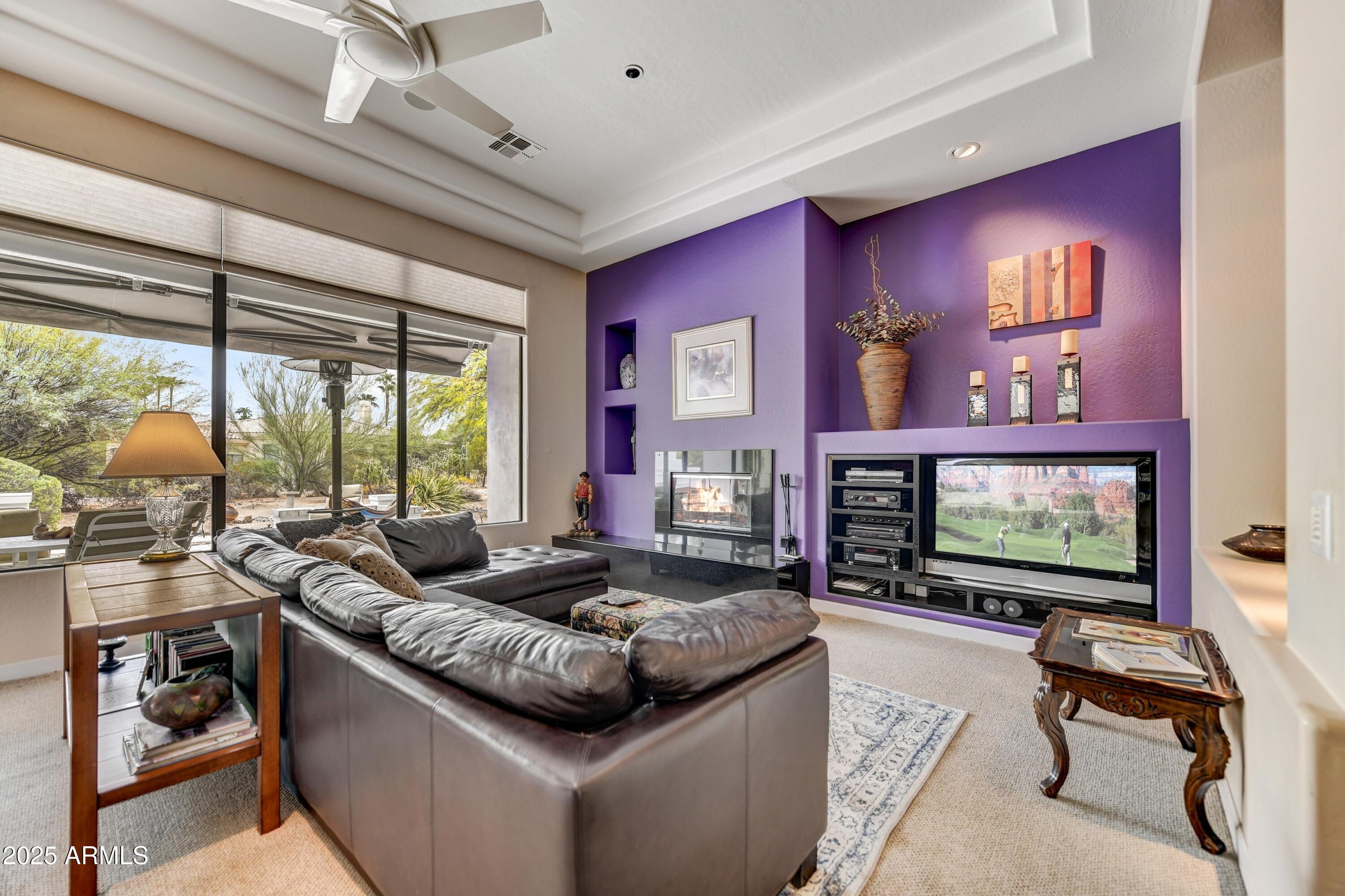 19057 East Alondra Way Rio Verde, AZ 85263 - Photo 5 of 21 a living room with furniture and a flat screen tv