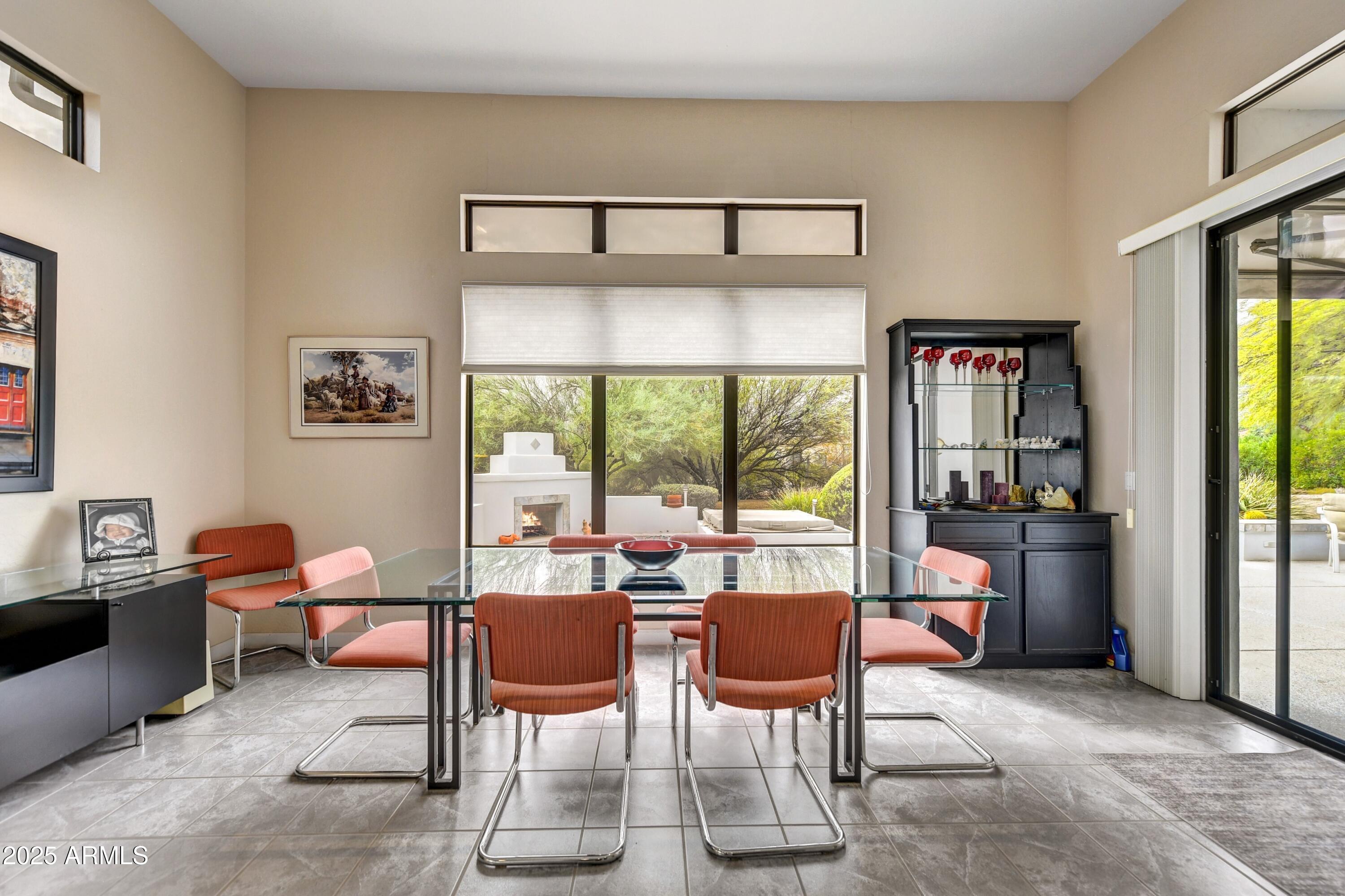 19057 East Alondra Way Rio Verde, AZ 85263 - Photo 9 of 21 a dining room with furniture a chandelier and window