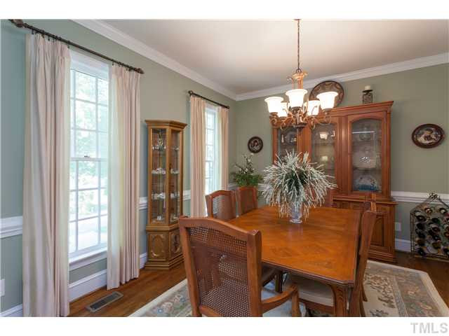 12405 Whartons Way Raleigh, NC 27613 - Photo 3 of 23 EXQUISITE DINING ROOM WITH CROWN MOLDING AND HARDWOOD FLOORS. PERFECT FOR ENTERTAINING. Dining Room