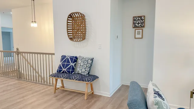 a bench sitting next to a wooden floor